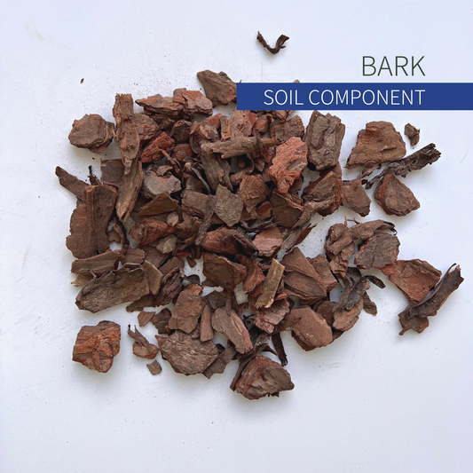 A pile of small brown bark nuggets