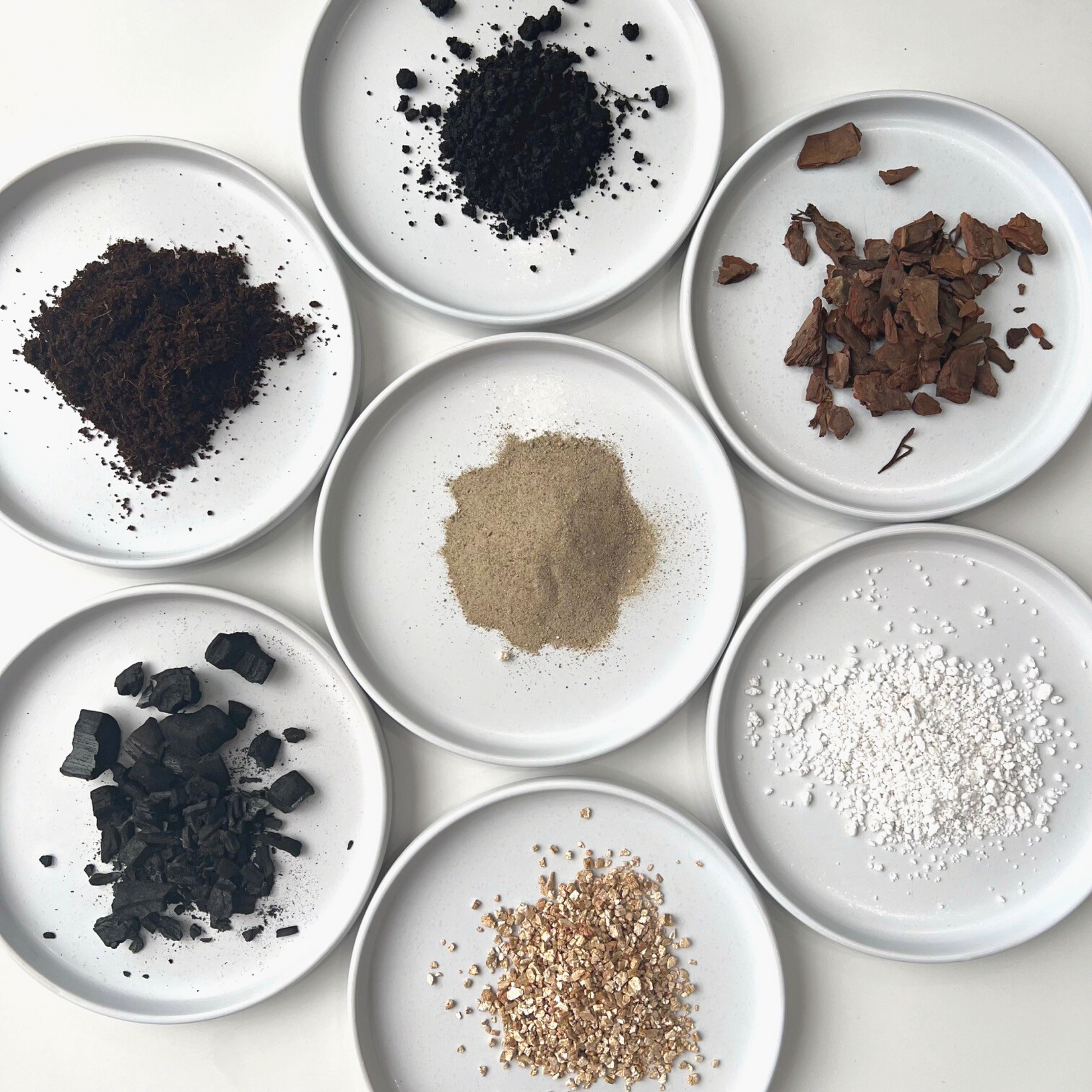 A ingredient makeup of Birdy's Plants Premium Ficus Soil Mix including sand, activated horticultural charcoal, orchid bark, vermiculite, coarse perlite, worm castings, and coco coir.
