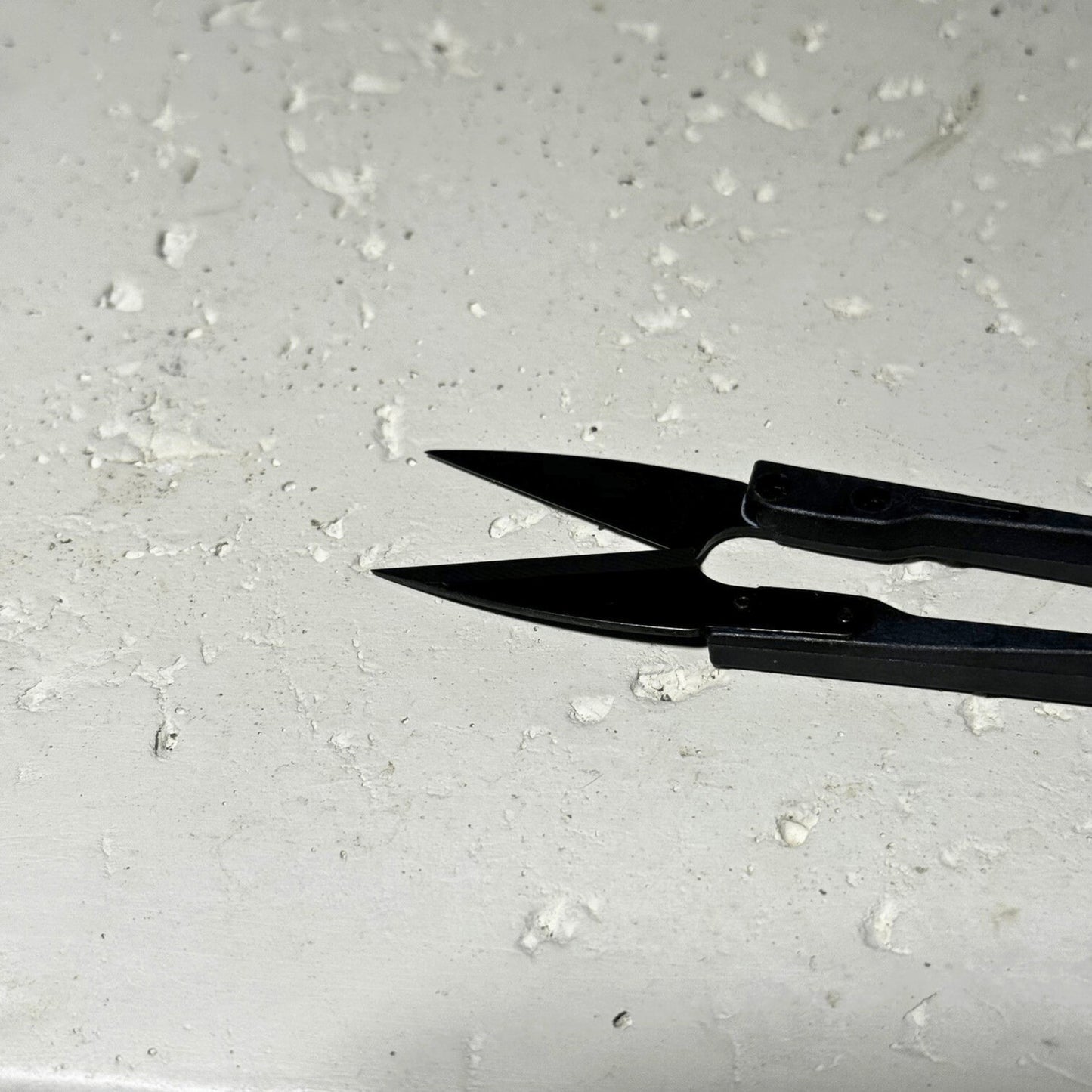 Close-up of pruning scissors blades on neutral background, sharp stainless steel tool for detailed plant trimming