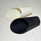 Black and white soil scoops on neutral background, indoor plant tools for precise soil transfer and repotting